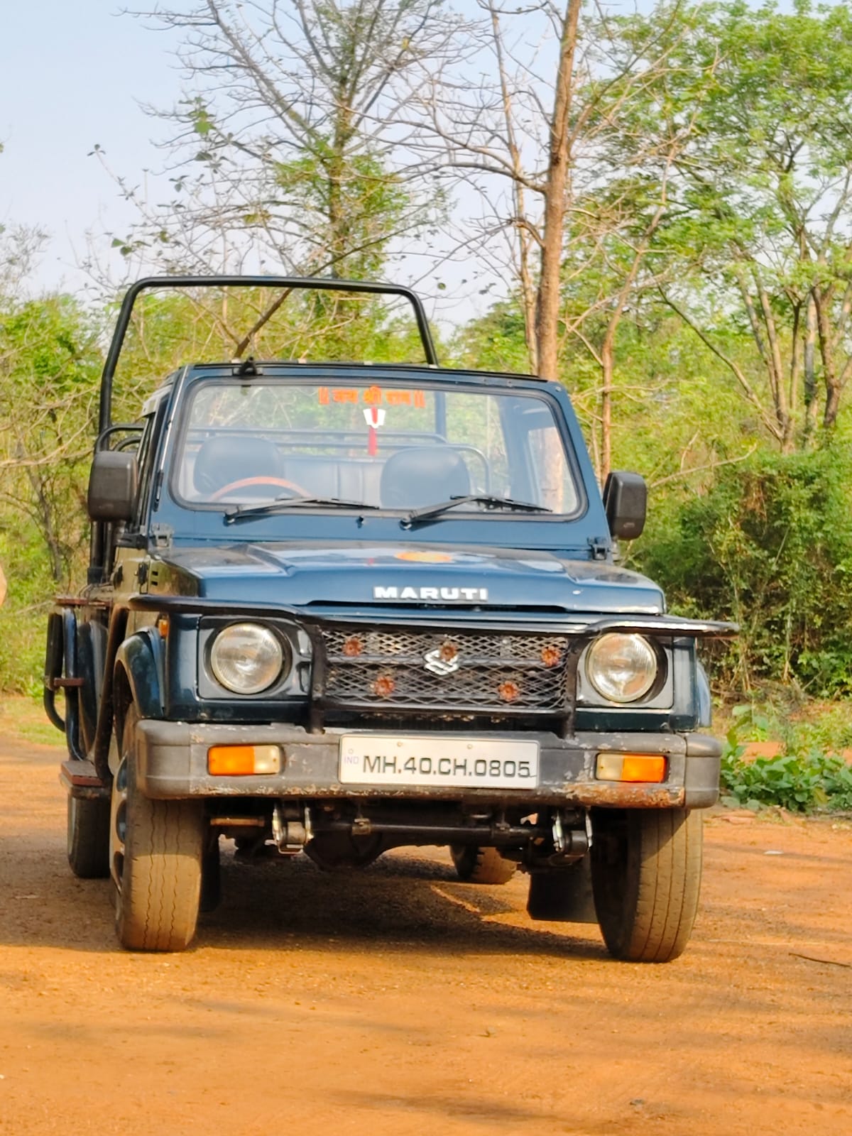 Maruti Gypsy safari jeep on forest road Tadoba